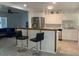 Modern kitchen featuring stainless steel appliances and a breakfast bar for casual dining at 106 E Wade St, Oxford, GA 30054