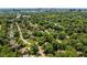 An aerial view of a neighborhood with mature trees and homes near the city skyline at 1180 Branch Water Ct, Dunwoody, GA 30338