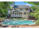 Backyard with inviting pool and landscaping at 1180 Branch Water Ct, Dunwoody, GA 30338