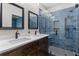 Bathroom features a double sink vanity, blue tiled shower, and modern fixtures at 1180 Branch Water Ct, Dunwoody, GA 30338