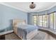 Bedroom featuring a neutral color palette, large bed, and bay windows at 1180 Branch Water Ct, Dunwoody, GA 30338