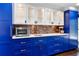 Chic kitchen with custom blue cabinets, white countertops, and modern appliances at 1180 Branch Water Ct, Dunwoody, GA 30338