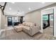 Open-concept living area with plush seating, leading to a stylish kitchen and adjacent bedroom at 1180 Branch Water Ct, Dunwoody, GA 30338