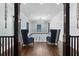 Elegant living room featuring hardwood floors, stylish furniture, and custom wall paneling at 1180 Branch Water Ct, Dunwoody, GA 30338