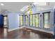 Light-filled sunroom with skylights, hardwood floors, and large windows overlooking the backyard at 1180 Branch Water Ct, Dunwoody, GA 30338