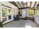Cozy screened porch with comfortable seating and views of the backyard at 1180 Branch Water Ct, Dunwoody, GA 30338