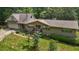 Charming home featuring a welcoming front porch, attached garage, and lush green surroundings at 2026 Mcdaniel Mill Sw Rd, Conyers, GA 30094