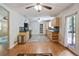 A cozy kitchen with a stainless steel trash can and a view to the living room at 2026 Mcdaniel Mill Sw Rd, Conyers, GA 30094