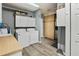 Laundry room with gray floors, sink, storage cabinets, washer and dryer at 2026 Mcdaniel Mill Sw Rd, Conyers, GA 30094