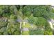 A wooded neighborhood featuring well-maintained homes and established landscaping at 2100 Shady Ln, Tucker, GA 30084