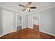 Spacious bedroom with hardwood floors, ensuite bathroom and access to additional rooms at 2100 Shady Ln, Tucker, GA 30084
