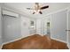 Bedroom features hardwood floors, ample natural light, and a mini-split system at 2100 Shady Ln, Tucker, GA 30084
