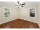 Cozy bedroom features refinished hardwood floors, large windows and natural light at 2100 Shady Ln, Tucker, GA 30084
