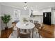 Dining area open to the updated kitchen; features stylish table and chairs at 2100 Shady Ln, Tucker, GA 30084