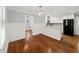 Charming dining area with wainscoting and a breakfast bar into the kitchen at 2100 Shady Ln, Tucker, GA 30084