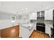 Updated kitchen with stainless steel appliances, granite countertops, and farmhouse sink at 2100 Shady Ln, Tucker, GA 30084
