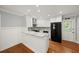 Updated kitchen with white cabinets, granite countertops, and stainless steel appliances at 2100 Shady Ln, Tucker, GA 30084