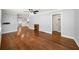 Spacious living room with hardwood floors, ceiling fan, and a cozy electric fireplace at 2100 Shady Ln, Tucker, GA 30084