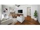 Bright living room with a ceiling fan, with elegant furniture, stylish rug and decor at 2100 Shady Ln, Tucker, GA 30084