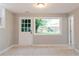 View of a basement featuring tile flooring, exterior access to the backyard, and modern lighting at 4339 Sasanqua Ct, Tucker, GA 30084