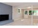 View of a basement featuring a decorative brick fireplace, tile flooring, and exterior access at 4339 Sasanqua Ct, Tucker, GA 30084