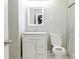 Bathroom featuring a vanity with white cabinets, toilet, and shower at 4339 Sasanqua Ct, Tucker, GA 30084