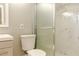 Modern bathroom featuring a stand-up shower with white marble tile and a glass door at 4339 Sasanqua Ct, Tucker, GA 30084