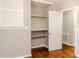 Bedroom closet with hardwood floors and built in shelving at 4339 Sasanqua Ct, Tucker, GA 30084