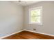 Bedroom with hardwood floors and a window offering natural light at 4339 Sasanqua Ct, Tucker, GA 30084