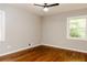 Bedroom with hardwood floors, two windows offering natural light and a ceiling fan at 4339 Sasanqua Ct, Tucker, GA 30084