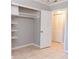 View of a closet with built-in shelving and a view into the laundry room with a bifold door at 4339 Sasanqua Ct, Tucker, GA 30084