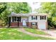 Charming two-story home featuring brick accents, gray siding, and a well-manicured lawn at 4339 Sasanqua Ct, Tucker, GA 30084