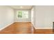 Bright living room featuring hardwood floors, a large window, and neutral paint at 4339 Sasanqua Ct, Tucker, GA 30084