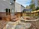 Backyard featuring a deck, patio area, and garden, perfect for outdoor entertaining and relaxation at 5105 N Bridges Dr, Alpharetta, GA 30022