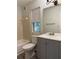 Updated bathroom with shower-tub combo and vanity with gray cabinets at 5105 N Bridges Dr, Alpharetta, GA 30022