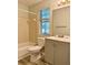 Updated bathroom with shower-tub combo and vanity with gray cabinets at 5105 N Bridges Dr, Alpharetta, GA 30022