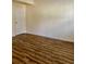 Bedroom featuring modern flooring and a freshly painted door, creating an inviting space at 5105 N Bridges Dr, Alpharetta, GA 30022