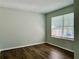 Clean bedroom featuring wood floors and natural lighting at 5105 N Bridges Dr, Alpharetta, GA 30022