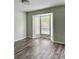 Bright bedroom featuring gray walls, wood flooring, and natural lighting at 5105 N Bridges Dr, Alpharetta, GA 30022