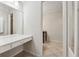 Bathroom featuring a vanity with storage and a large mirror at 1416 Oakridge Cir, Decatur, GA 30033