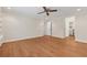 Large bedroom with wood-look floors, a ceiling fan, and adjacent access to other rooms at 1416 Oakridge Cir, Decatur, GA 30033