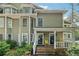 Charming townhome featuring a welcoming front porch and lush landscaping at 1416 Oakridge Cir, Decatur, GA 30033
