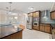Bright kitchen featuring stainless steel appliances, granite counters, and an eat-in breakfast bar at 1416 Oakridge Cir, Decatur, GA 30033