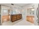 Open kitchen with wood cabinets, view to living spaces and dining area at 1416 Oakridge Cir, Decatur, GA 30033