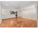 Bright living room with hardwood floors, and an open view to the kitchen and breakfast area at 1416 Oakridge Cir, Decatur, GA 30033