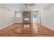 Bright living room with hardwood floors featuring a stone fireplace and recessed lighting at 1416 Oakridge Cir, Decatur, GA 30033