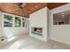 Bright sunroom features tile floors, wood ceiling, fireplace, and great views of the outdoors at 1416 Oakridge Cir, Decatur, GA 30033