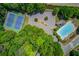 Aerial view of community amenities including tennis courts, pool, and parking at 1657 Hampton Woods Way, Lawrenceville, GA 30043