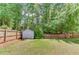 Spacious backyard with a storage shed and a privacy fence at 1657 Hampton Woods Way, Lawrenceville, GA 30043