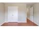 Bright bedroom features hardwood floors, neutral walls, and a closet at 1657 Hampton Woods Way, Lawrenceville, GA 30043